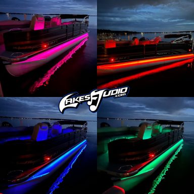 A boat illuminated with colorful LED lights on the water at dusk.