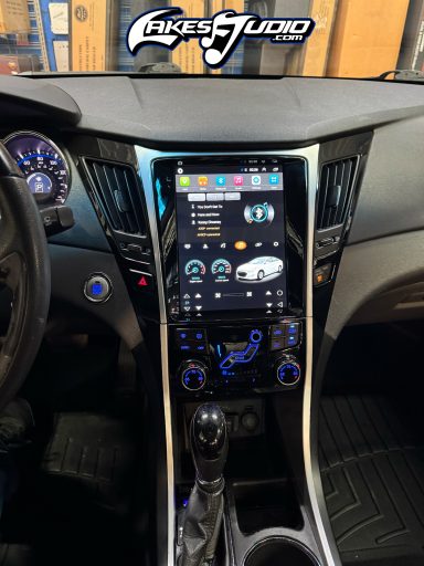 Interior view of a car dashboard featuring a large touchscreen display.